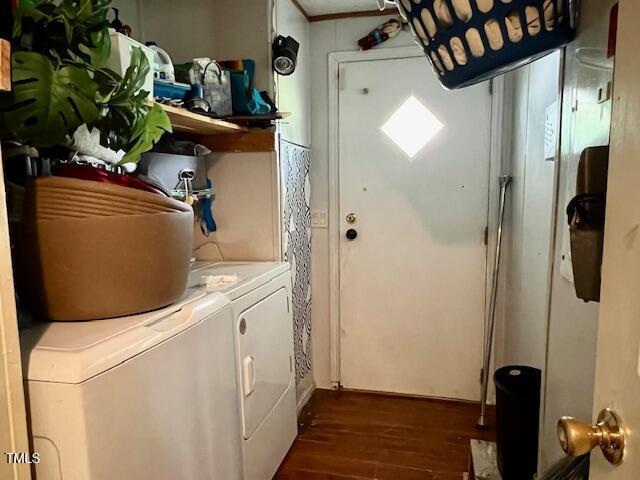 174 Daffodil Dr, Henderson, NC 27537 - laundry room featuring washer and dryer and dark wood-style floors