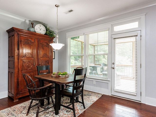 8712 Halsey Ln, Wake Forest, NC 27587 - dining room featuring dark wood-type flooring, plenty of natural light, and crown molding