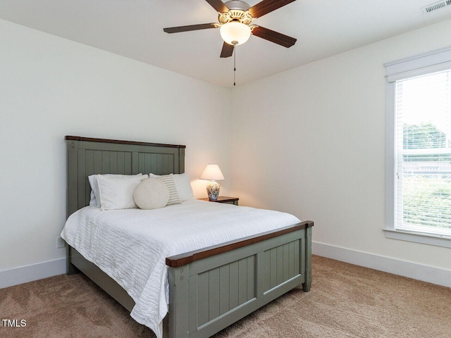 8712 Halsey Ln, Wake Forest, NC 27587 - bedroom featuring light carpet, multiple windows, and a ceiling fan