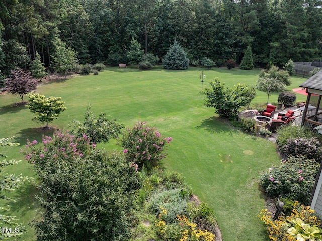 8712 Halsey Ln, Wake Forest, NC 27587 - view of grassy yard featuring a fire pit