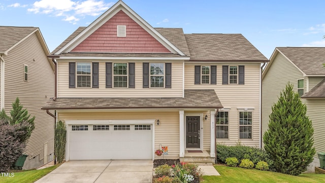 837 Stable Fern Dr, Fuquay Varina, NC 27526 - view of front of home with an attached garage, driveway, a shingled roof, and a front lawn