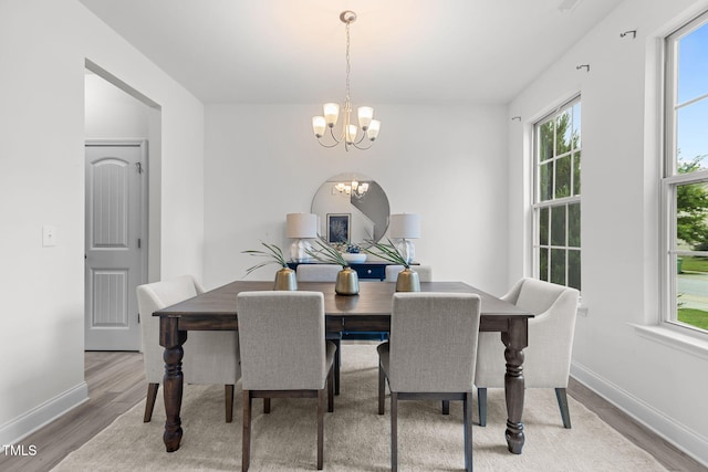837 Stable Fern Dr, Fuquay Varina, NC 27526 - dining space featuring a chandelier and wood finished floors