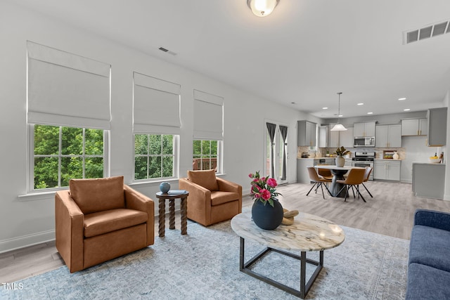 837 Stable Fern Dr, Fuquay Varina, NC 27526 - living room featuring light wood-type flooring, plenty of natural light, and recessed lighting