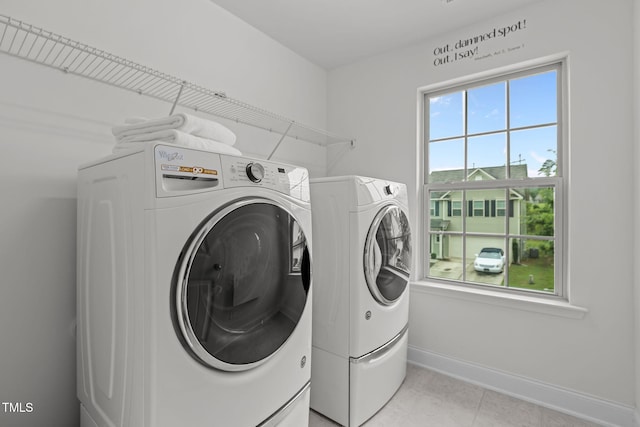 837 Stable Fern Dr, Fuquay Varina, NC 27526 - laundry room with independent washer and dryer and light tile patterned floors