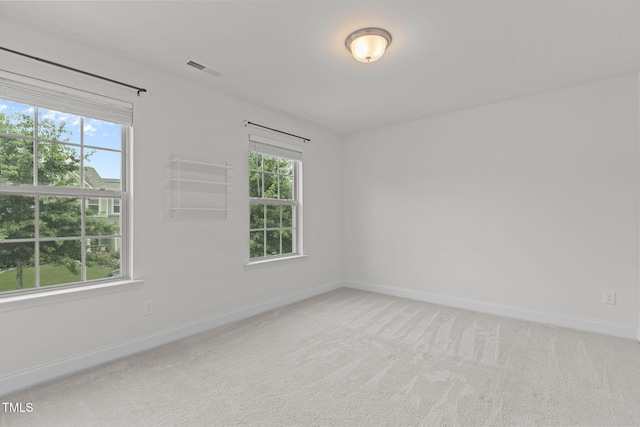 837 Stable Fern Dr, Fuquay Varina, NC 27526 - unfurnished room featuring plenty of natural light and light colored carpet