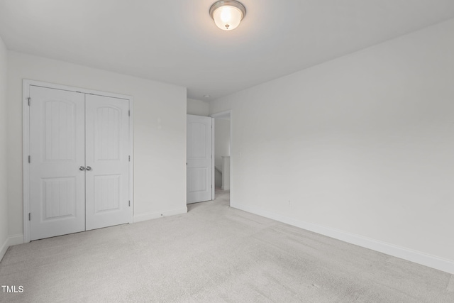 837 Stable Fern Dr, Fuquay Varina, NC 27526 - unfurnished bedroom featuring light colored carpet and a closet