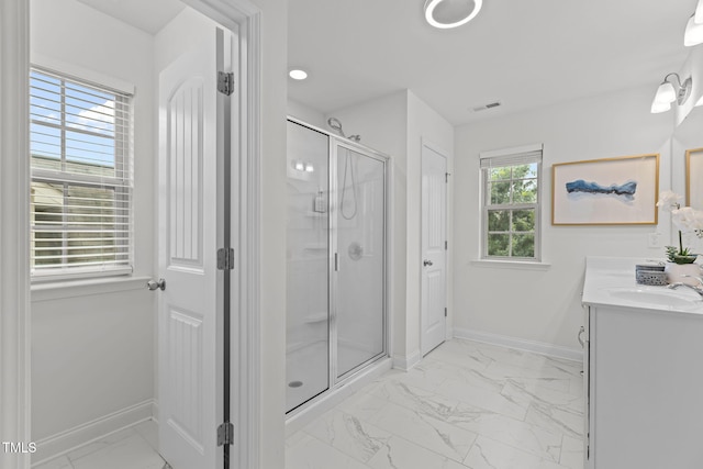 837 Stable Fern Dr, Fuquay Varina, NC 27526 - bathroom with marble look tiles, vanity, and a stall shower