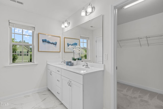837 Stable Fern Dr, Fuquay Varina, NC 27526 - bathroom with double vanity, marble finish floors, and a spacious closet