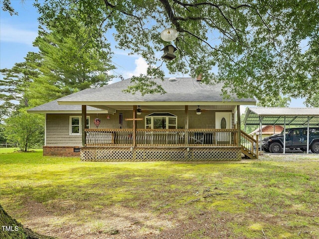 358 Benjie Williams Rd, Staley, NC 27355 - back of house featuring ceiling fan, a yard, roof with shingles, and a detached carport