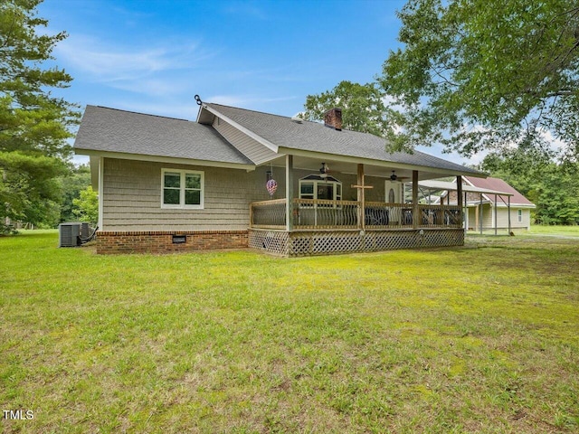 358 Benjie Williams Rd, Staley, NC 27355 - back of property featuring ceiling fan, a lawn, a chimney, and a wooden deck