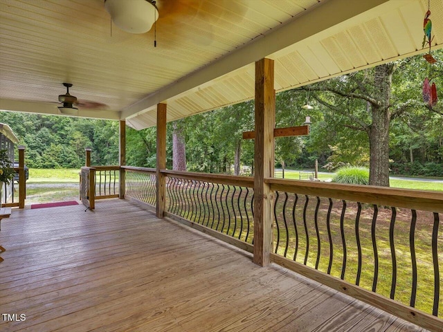 358 Benjie Williams Rd, Staley, NC 27355 - wooden deck featuring a ceiling fan and view of scattered trees