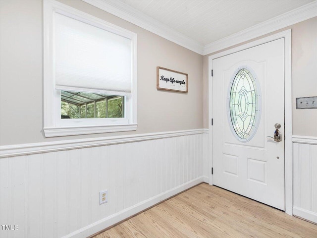 358 Benjie Williams Rd, Staley, NC 27355 - entrance foyer featuring light wood-style flooring, wainscoting, and crown molding