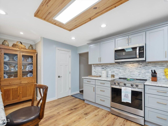 358 Benjie Williams Rd, Staley, NC 27355 - kitchen featuring stainless steel appliances, gray cabinets, tasteful backsplash, recessed lighting, and crown molding