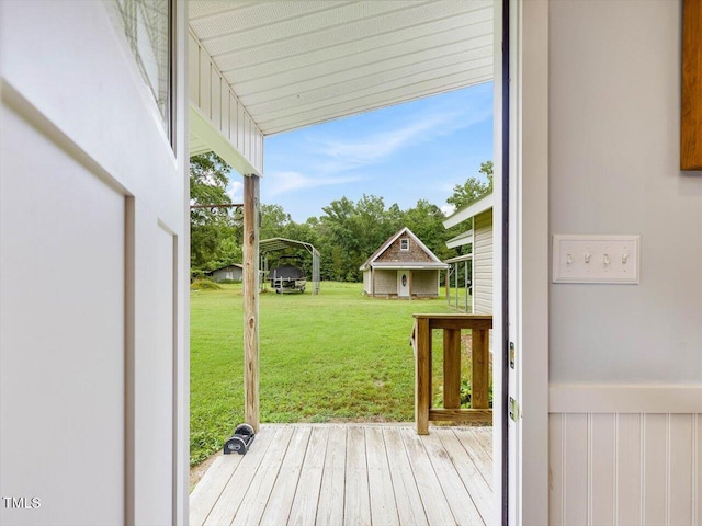358 Benjie Williams Rd, Staley, NC 27355 - wooden terrace with a lawn and a carport