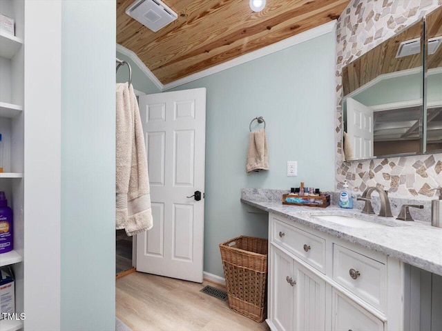 358 Benjie Williams Rd, Staley, NC 27355 - bathroom featuring wood finished floors, vanity, decorative backsplash, wooden ceiling, and lofted ceiling