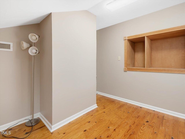 358 Benjie Williams Rd, Staley, NC 27355 - hallway featuring vaulted ceiling and light wood-style floors