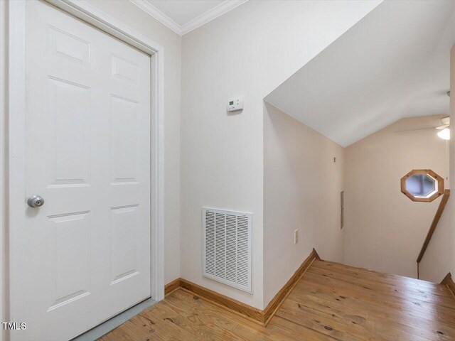 358 Benjie Williams Rd, Staley, NC 27355 - entrance foyer with light wood-type flooring, ornamental molding, and lofted ceiling