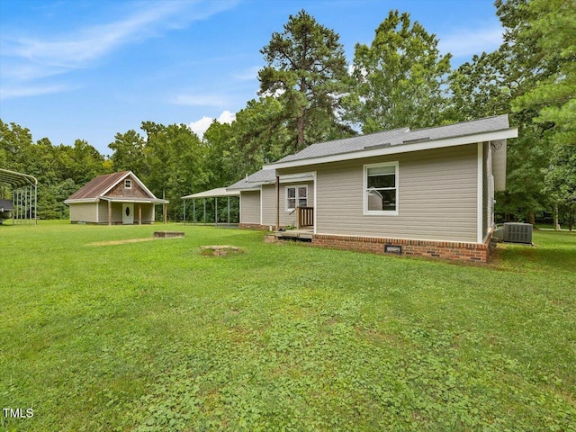 358 Benjie Williams Rd, Staley, NC 27355 - view of green lawn with a carport and view of scattered trees