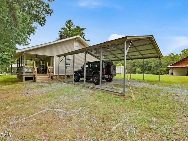 358 Benjie Williams Rd, Staley, NC 27355 - view of vehicle parking with ceiling fan, a detached carport, and driveway