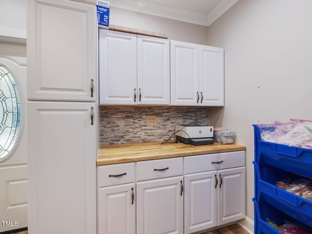 358 Benjie Williams Rd, Staley, NC 27355 - kitchen with wood counters, ornamental molding, decorative backsplash, and white cabinetry