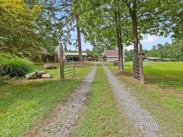 358 Benjie Williams Rd, Staley, NC 27355 - view of front facade featuring driveway and a front yard