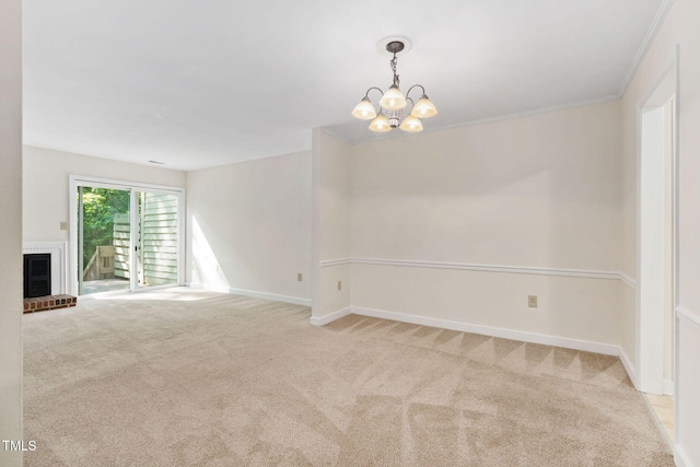 15 Willow Bridge Dr, Durham, NC 27707 - empty room featuring carpet flooring, a chandelier, a brick fireplace, and crown molding