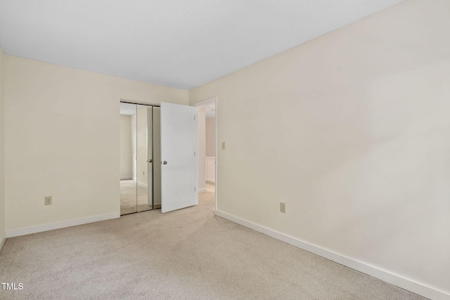 15 Willow Bridge Dr, Durham, NC 27707 - unfurnished bedroom featuring light carpet and a closet