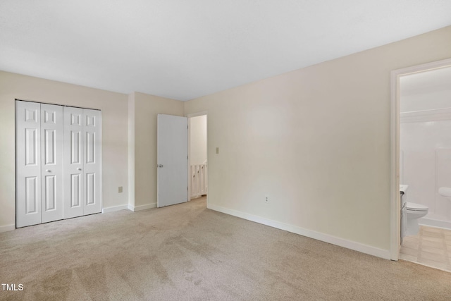 15 Willow Bridge Dr, Durham, NC 27707 - unfurnished bedroom featuring light carpet, connected bathroom, and a closet