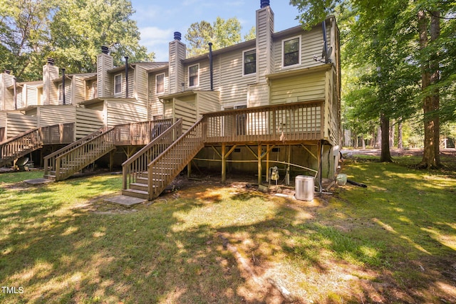 15 Willow Bridge Dr, Durham, NC 27707 - back of property featuring a chimney, stairs, a lawn, and a wooden deck