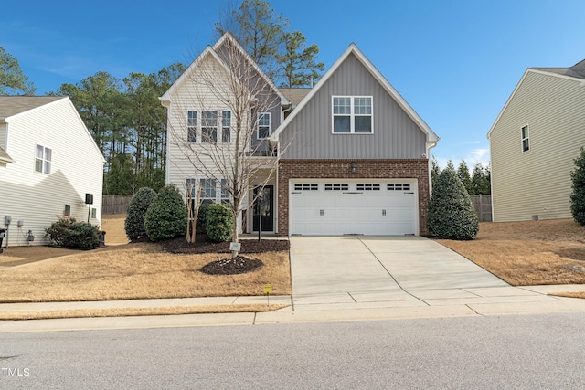 165 Naples Ln, Clayton, NC 27527 - view of front of home featuring board and batten siding, brick siding, concrete driveway, and an attached garage