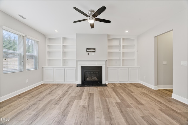 165 Naples Ln, Clayton, NC 27527 - unfurnished living room featuring light wood finished floors, ceiling fan, a fireplace, recessed lighting, and built in shelves