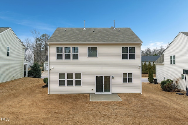 165 Naples Ln, Clayton, NC 27527 - rear view of house featuring a patio, a lawn, and a shingled roof