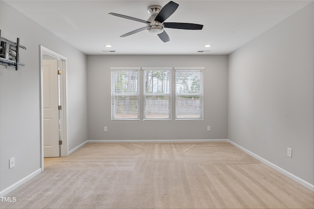 165 Naples Ln, Clayton, NC 27527 - spare room featuring light carpet, ceiling fan, and recessed lighting