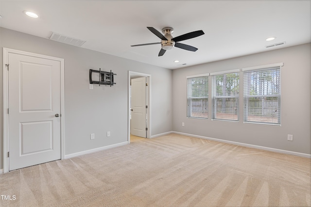 165 Naples Ln, Clayton, NC 27527 - unfurnished bedroom featuring light colored carpet, recessed lighting, and a ceiling fan