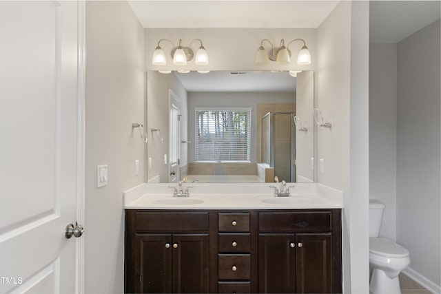 165 Naples Ln, Clayton, NC 27527 - full bathroom with a shower stall, double vanity, and a garden tub