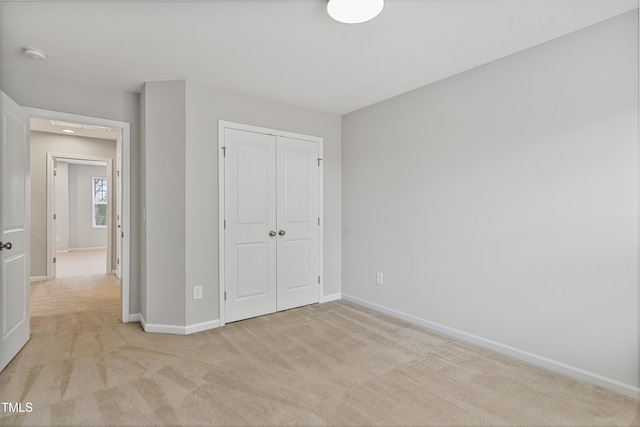 165 Naples Ln, Clayton, NC 27527 - unfurnished bedroom featuring light carpet and a closet