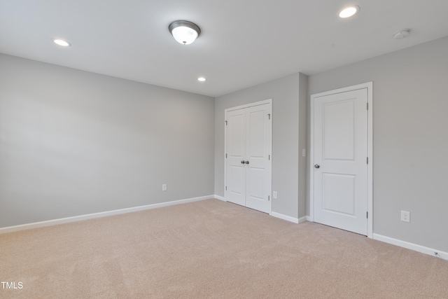 165 Naples Ln, Clayton, NC 27527 - unfurnished bedroom with carpet, recessed lighting, and a closet