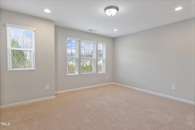 165 Naples Ln, Clayton, NC 27527 - spare room featuring plenty of natural light, light carpet, and recessed lighting