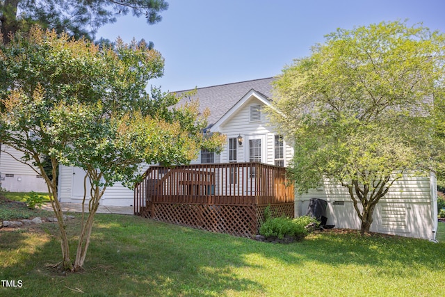 3213 Planet Dr, Raleigh, NC 27604 - rear view of property featuring a yard, a wooden deck, and roof with shingles