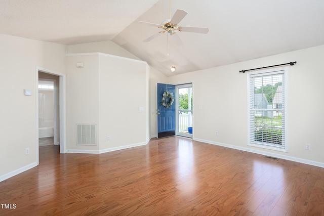 3213 Planet Dr, Raleigh, NC 27604 - unfurnished room featuring wood finished floors, vaulted ceiling, and a ceiling fan