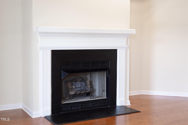 3213 Planet Dr, Raleigh, NC 27604 - detailed view of a fireplace with raised hearth and wood finished floors