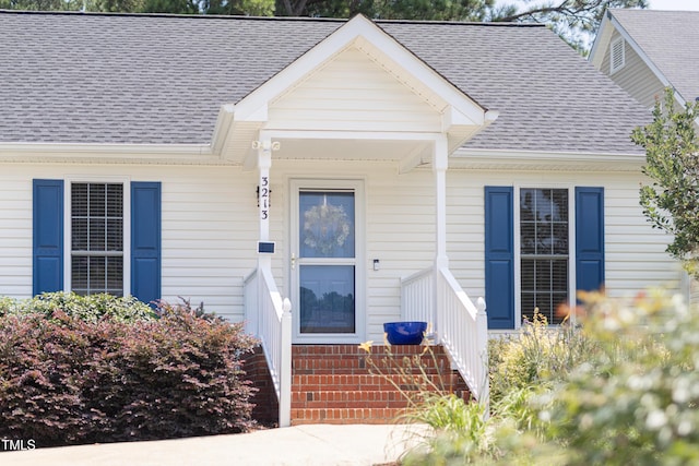 3213 Planet Dr, Raleigh, NC 27604 - entrance to property with a shingled roof