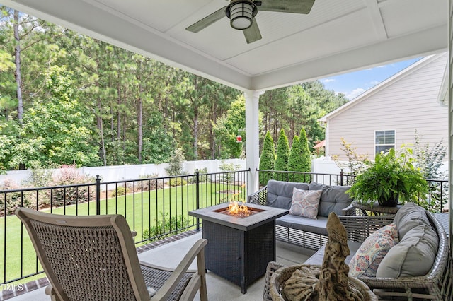630 Heartland Flyer Dr, Knightdale, NC 27545 - wooden terrace with an outdoor living space with a fire pit, a ceiling fan, and a fenced backyard