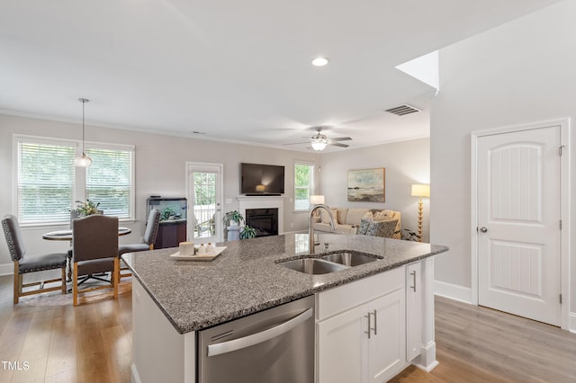 630 Heartland Flyer Dr, Knightdale, NC 27545 - kitchen with dishwasher, stone counters, light wood finished floors, a ceiling fan, and ornamental molding