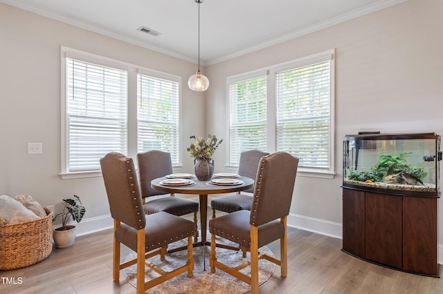 630 Heartland Flyer Dr, Knightdale, NC 27545 - dining area featuring light wood finished floors and crown molding