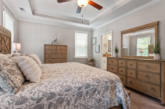 630 Heartland Flyer Dr, Knightdale, NC 27545 - carpeted bedroom with a raised ceiling, ornamental molding, connected bathroom, and a ceiling fan