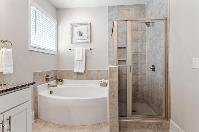 630 Heartland Flyer Dr, Knightdale, NC 27545 - bathroom with a bath, vanity, a shower stall, and tile patterned flooring