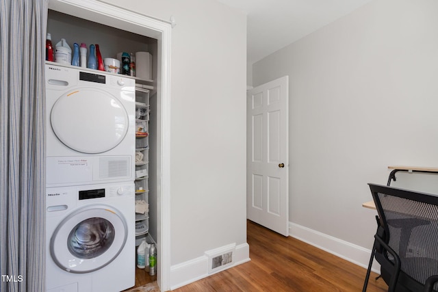 1701 Ruffin St, Durham, NC 27701 - washroom featuring estacked washer and dryer and wood finished floors