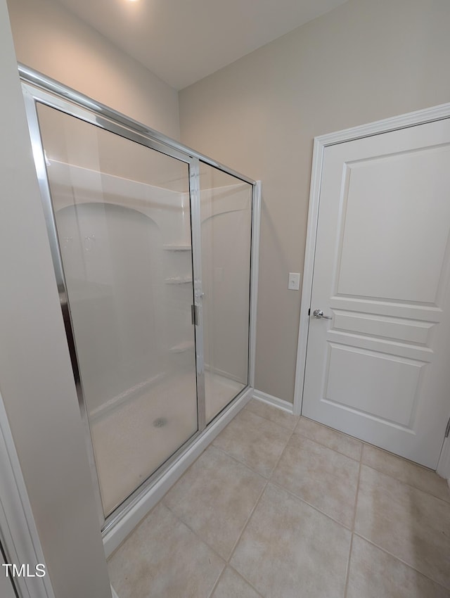 4221 Del Webb Ave, Cary, NC 27519 - bathroom featuring tile patterned floors and a shower stall