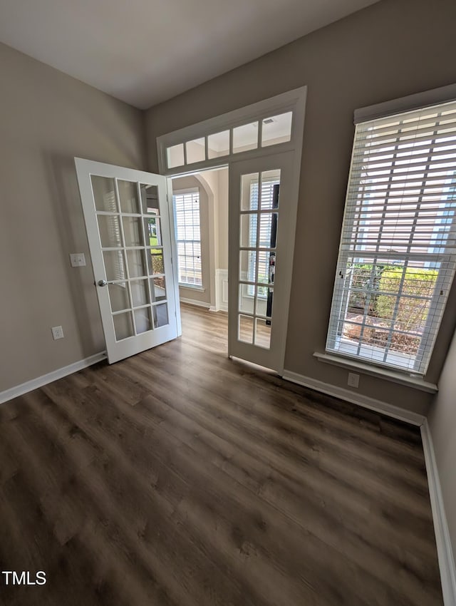 4221 Del Webb Ave, Cary, NC 27519 - spare room with dark wood-style floors and arched walkways